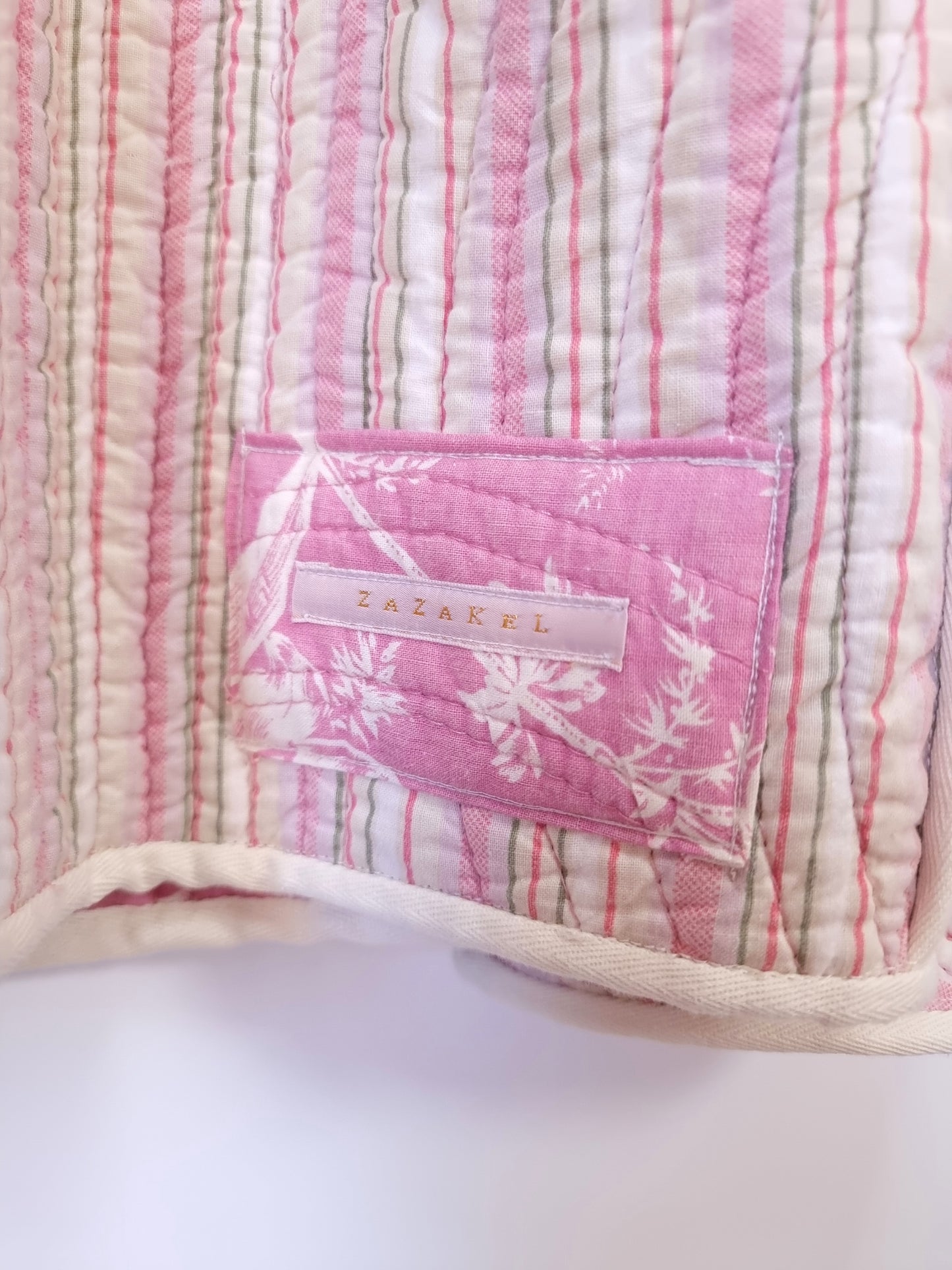 Veste matelassée boutis rouge rose